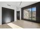 Bright bedroom with mountain views and dark closet doors at 8200 N Charles Dr, Paradise Valley, AZ 85253