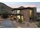 Modern home with stone accents and a sleek design at 8200 N Charles Dr, Paradise Valley, AZ 85253