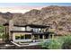 Stunning modern home with stone accents, nestled in the mountains at 8200 N Charles Dr, Paradise Valley, AZ 85253