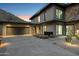 Contemporary home with a sleek, dark garage door at 8200 N Charles Dr, Paradise Valley, AZ 85253