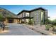 Contemporary home with stone facade and attached garage at 8200 N Charles Dr, Paradise Valley, AZ 85253