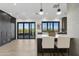 Kitchen island with white quartz countertop and access to a deck at 8200 N Charles Dr, Paradise Valley, AZ 85253