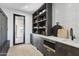 Modern laundry room with built-in shelving and storage at 8200 N Charles Dr, Paradise Valley, AZ 85253