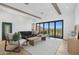 Living room with a view, modern furniture, and light floors at 8200 N Charles Dr, Paradise Valley, AZ 85253