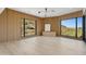 Bright home office with wood wall accents and expansive windows at 8200 N Charles Dr, Paradise Valley, AZ 85253