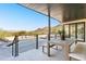 Covered patio with outdoor seating and mountain views at 8200 N Charles Dr, Paradise Valley, AZ 85253