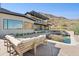 Modern pool and patio furniture with mountain backdrop at 8200 N Charles Dr, Paradise Valley, AZ 85253