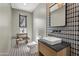 Small powder room with unique geometric tile and floating vanity at 8200 N Charles Dr, Paradise Valley, AZ 85253