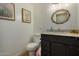 Modern bathroom with dark vanity, white subway tile, and a contemporary mirror at 8241 N Central Ave # 32, Phoenix, AZ 85020