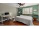 Bright bedroom with wood floors, a ceiling fan, and a workspace at 8241 N Central Ave # 32, Phoenix, AZ 85020