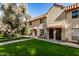 View of three-unit Spanish-style building with lush landscaping at 8241 N Central Ave # 32, Phoenix, AZ 85020