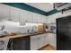 Clean and efficient kitchen featuring white cabinets and butcher block counters at 8241 N Central Ave # 32, Phoenix, AZ 85020