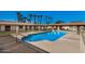 Community swimming pool with surrounding patio and palm trees at 8241 N Central Ave # 32, Phoenix, AZ 85020