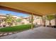 Covered patio, artificial turf and landscaped backyard at 8766 W Desert Trl, Peoria, AZ 85381