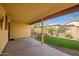 Covered patio, artificial turf and landscaped backyard at 8766 W Desert Trl, Peoria, AZ 85381