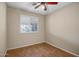 Bright bedroom with wood-look floors and ceiling fan at 8766 W Desert Trl, Peoria, AZ 85381