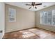 Bright bedroom with tile floors and ceiling fan at 8766 W Desert Trl, Peoria, AZ 85381