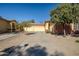 House exterior with double garage and driveway at 8766 W Desert Trl, Peoria, AZ 85381