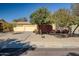 House exterior with double garage and landscaping at 8766 W Desert Trl, Peoria, AZ 85381