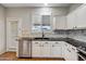 Kitchen with granite countertops and white cabinets at 8766 W Desert Trl, Peoria, AZ 85381