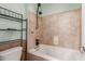 Bathroom with tub and shower, and a shelving unit at 8841 W Cordes Rd, Tolleson, AZ 85353