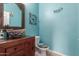 Bathroom with decorative sink and light blue walls at 8841 W Cordes Rd, Tolleson, AZ 85353