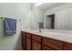 Clean bathroom with wood cabinets and a vanity with sink at 8841 W Cordes Rd, Tolleson, AZ 85353