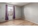 Bright bedroom with wood-look floors and window coverings at 8841 W Cordes Rd, Tolleson, AZ 85353