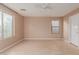 Well-lit bedroom with wood-look floors and a ceiling fan at 8841 W Cordes Rd, Tolleson, AZ 85353