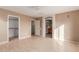 Bedroom with wood-look floors, a large closet, and ensuite bathroom at 8841 W Cordes Rd, Tolleson, AZ 85353