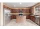 Spacious kitchen with wood cabinets and stainless steel appliances at 8841 W Cordes Rd, Tolleson, AZ 85353