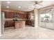 Kitchen features wood cabinets, stainless steel appliances, and an island at 8841 W Cordes Rd, Tolleson, AZ 85353