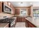 View of kitchen with gas range and stainless steel appliances at 8841 W Cordes Rd, Tolleson, AZ 85353