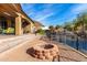 Landscaped backyard with fire pit and mountain views at 9535 E Mclellan Rd, Mesa, AZ 85207