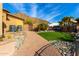 Landscaped backyard with artificial turf and mountain views at 9535 E Mclellan Rd, Mesa, AZ 85207