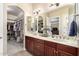 Bathroom with double vanity and walk-in closet at 9535 E Mclellan Rd, Mesa, AZ 85207