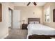 Bright bedroom with double bed, nightstand, and window shutters at 9535 E Mclellan Rd, Mesa, AZ 85207