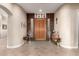 Elegant entryway with wood door and decorative glass at 9535 E Mclellan Rd, Mesa, AZ 85207