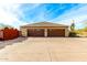 Three car garage with wood doors at 9535 E Mclellan Rd, Mesa, AZ 85207