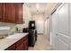 Laundry room with washer, dryer, sink, and cabinets at 9535 E Mclellan Rd, Mesa, AZ 85207