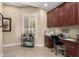 Home office with built-in desk and cabinets, providing ample workspace at 9535 E Mclellan Rd, Mesa, AZ 85207