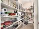 Walk-in pantry with ample shelving for storage at 9535 E Mclellan Rd, Mesa, AZ 85207