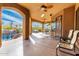 Relaxing covered patio with seating area and pool views at 9535 E Mclellan Rd, Mesa, AZ 85207