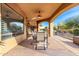 Large covered patio with seating area, ceiling fans, and views of the pool at 9535 E Mclellan Rd, Mesa, AZ 85207