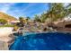 Inviting pool with a waterslide and diving board, perfect for summer fun at 9535 E Mclellan Rd, Mesa, AZ 85207