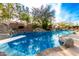 Large inviting pool with a diving board and a rock waterfall feature at 9535 E Mclellan Rd, Mesa, AZ 85207