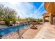 Inviting pool area with fire pit and expansive backyard at 9535 E Mclellan Rd, Mesa, AZ 85207