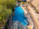 Relaxing pool area with a waterfall and diving board at 9535 E Mclellan Rd, Mesa, AZ 85207