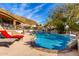 Resort-style pool with a relaxing lounge chair and mountain views at 9535 E Mclellan Rd, Mesa, AZ 85207