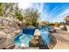 Relaxing pool with diving board and rock waterfall feature at 9535 E Mclellan Rd, Mesa, AZ 85207